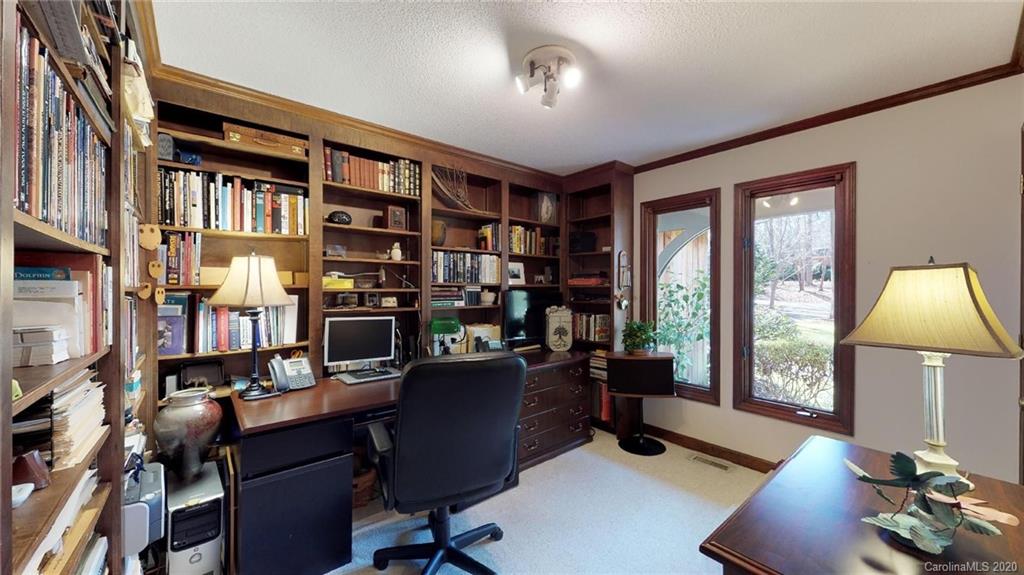 3002 High Ridge Road Charlotte, NC 28270 - Photo 21 of 41 a work room with furniture bookshelf and a window