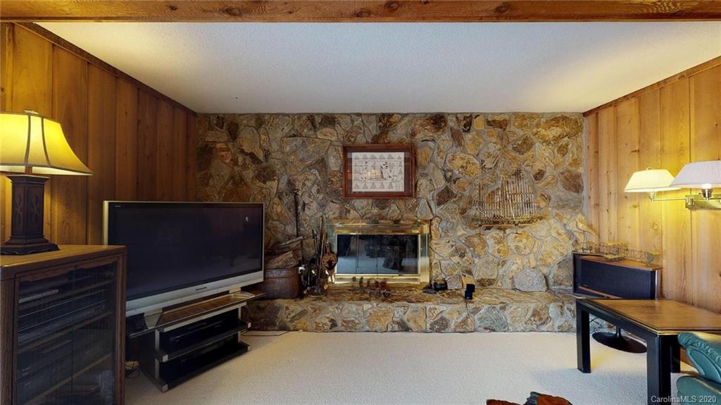 3002 High Ridge Road Charlotte, NC 28270 - Photo 24 of 41 a living room with furniture flat screen tv and a fireplace