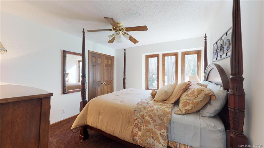 3002 High Ridge Road Charlotte, NC 28270 - Photo 33 of 41 a bedroom with a bed and wooden floor