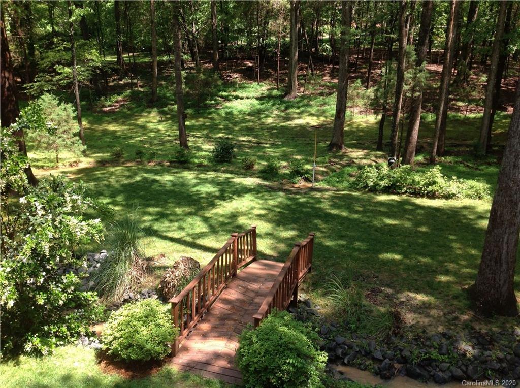 3002 High Ridge Road Charlotte, NC 28270 - Photo 35 of 41 a backyard of a house with lots of green space