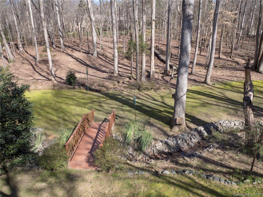 3002 High Ridge Road Charlotte, NC 28270 - Photo 7 of 41 a view of a yard with wooden fence