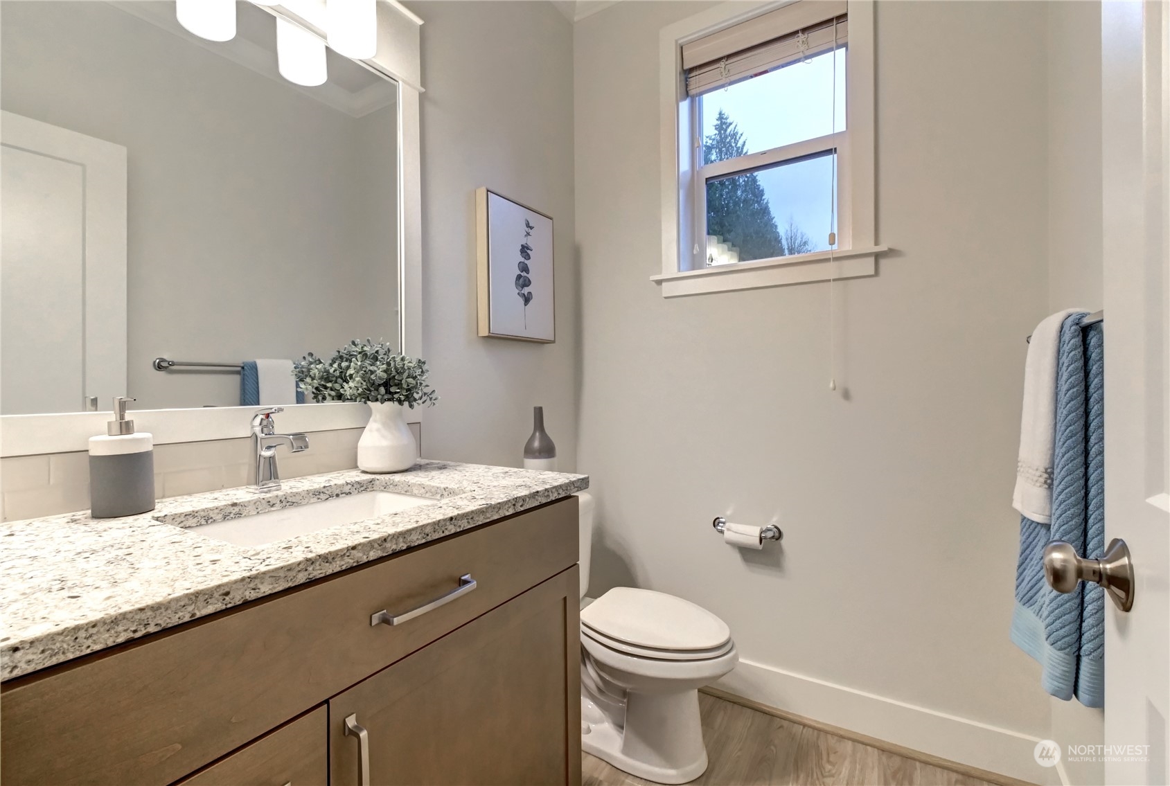 4431 231st Place Southeast Bothell, WA 98021 - Photo 14 of 36 a bathroom with a granite countertop sink a toilet and a mirror