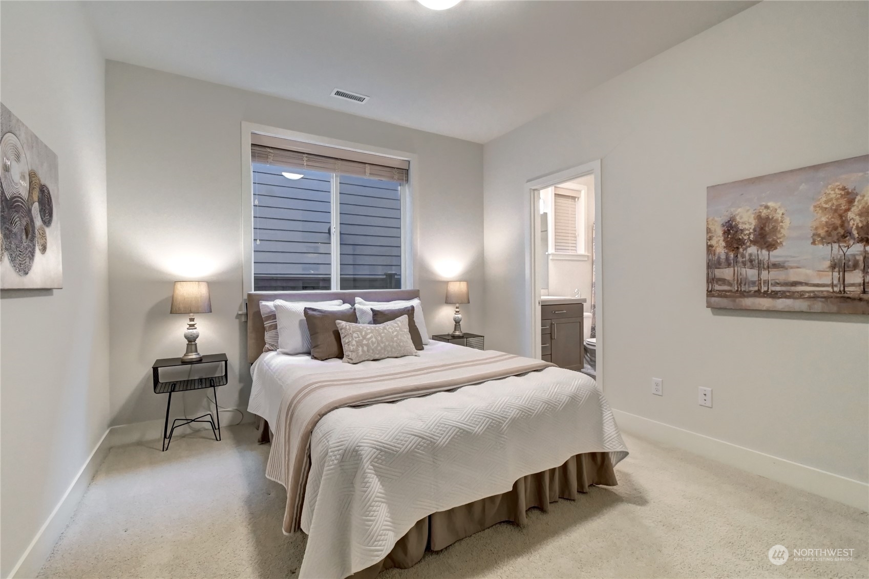 4431 231st Place Southeast Bothell, WA 98021 - Photo 16 of 36 a bedroom with a bed and a painting on the wall