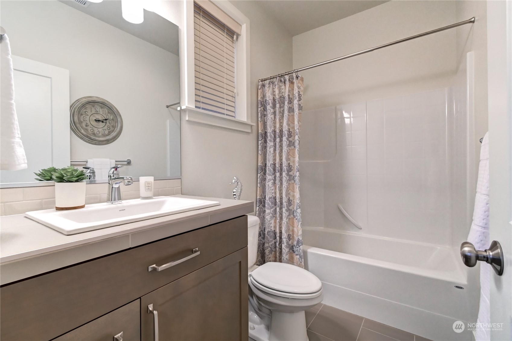 4431 231st Place Southeast Bothell, WA 98021 - Photo 18 of 36 a bathroom with a sink a toilet and a bathtub