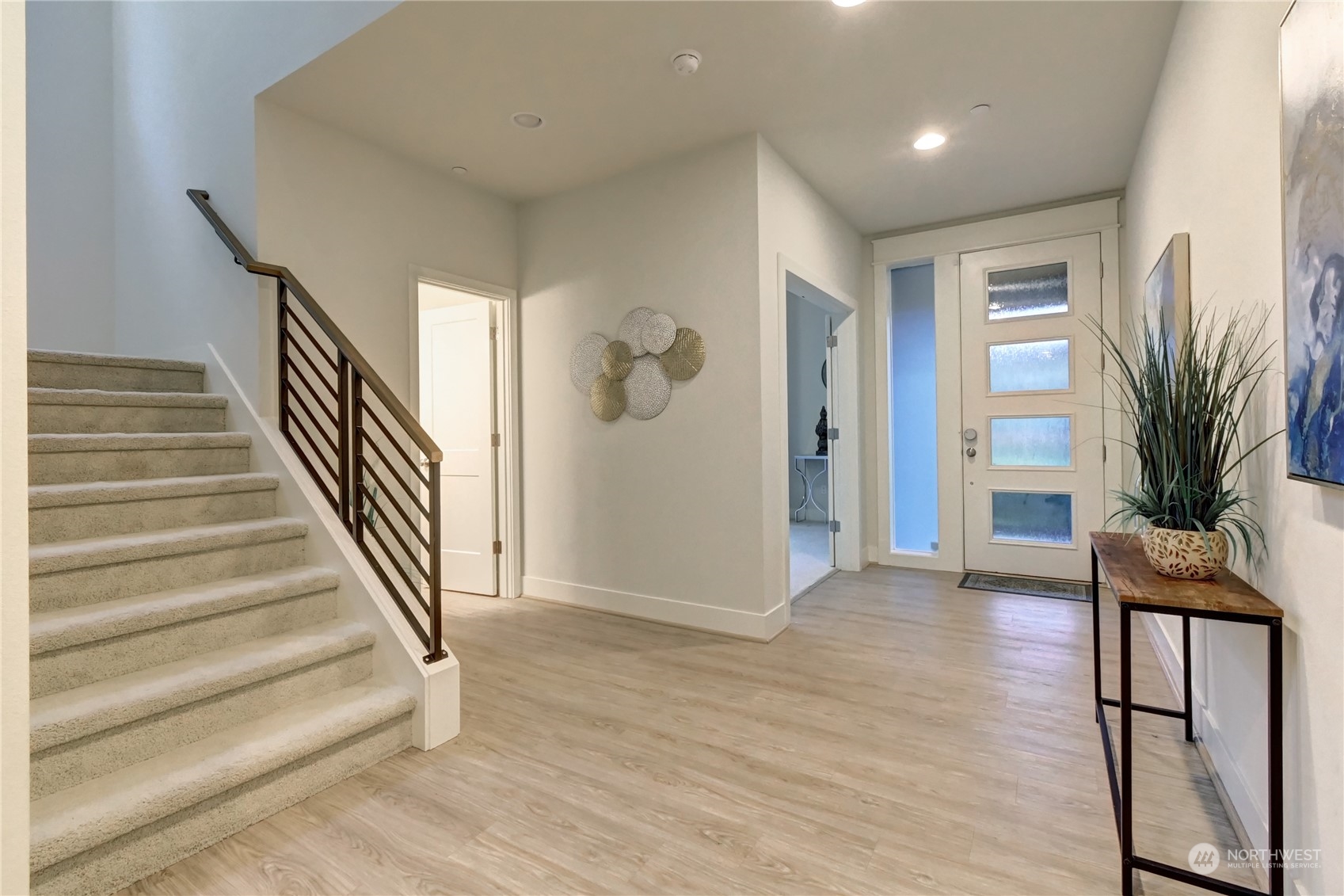 4431 231st Place Southeast Bothell, WA 98021 - Photo 2 of 36 a view of entryway with wooden floor and stairs