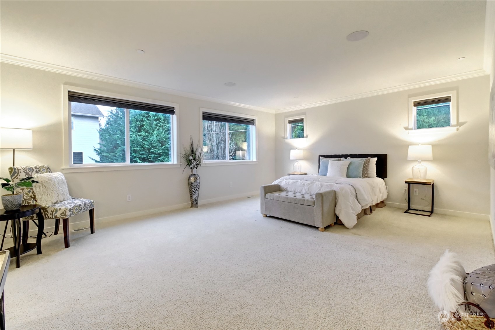 4431 231st Place Southeast Bothell, WA 98021 - Photo 21 of 36 a spacious bedroom with a bed and a couch