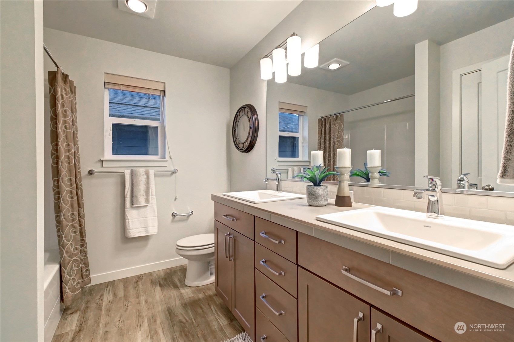 4431 231st Place Southeast Bothell, WA 98021 - Photo 25 of 36 a bathroom with a double vanity sink mirror and toilet