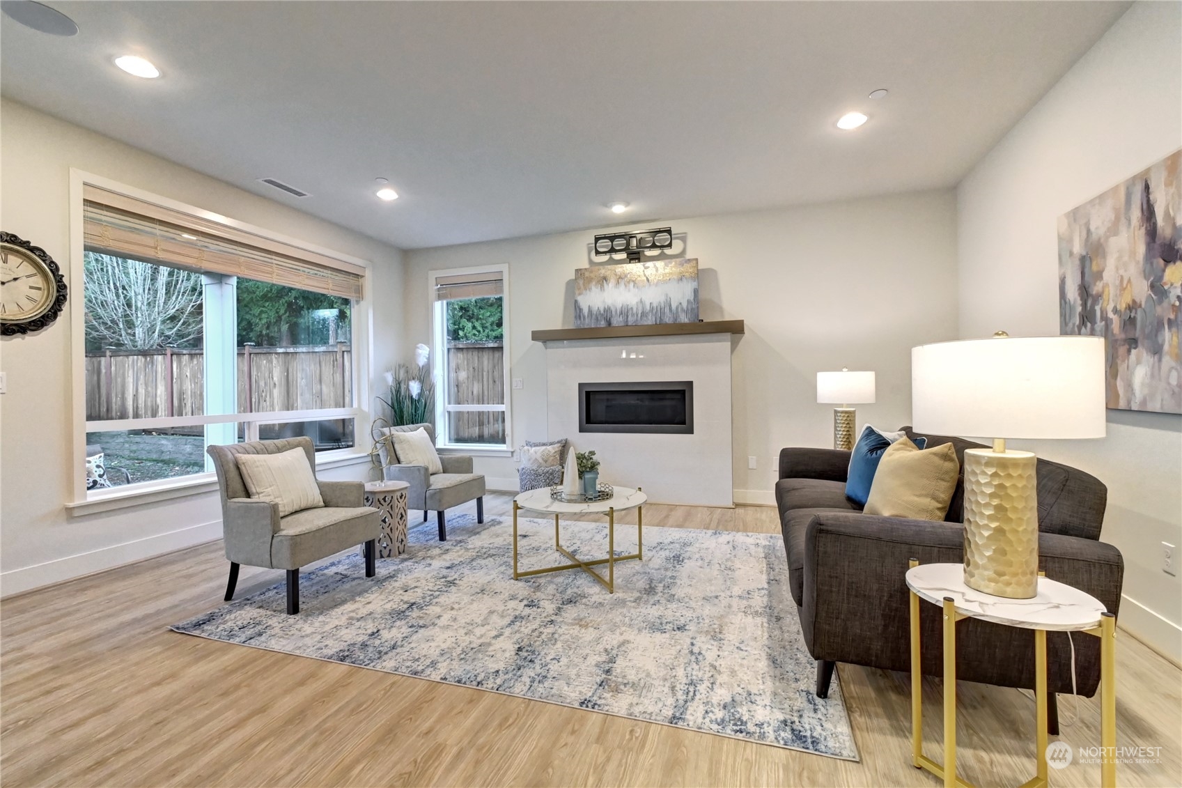 4431 231st Place Southeast Bothell, WA 98021 - Photo 3 of 36 a living room with furniture and a fireplace