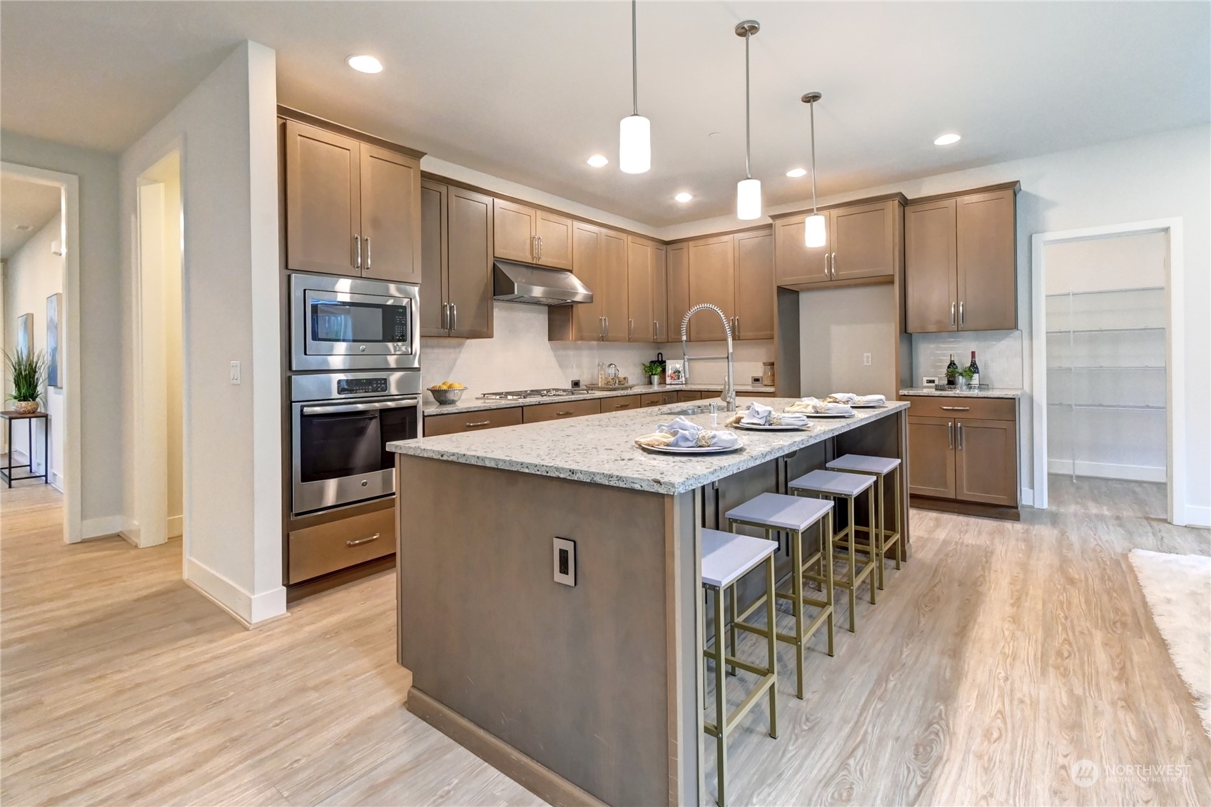 4431 231st Place Southeast Bothell, WA 98021 - Photo 7 of 36 a kitchen with a sink a counter top space stainless steel appliances and cabinets