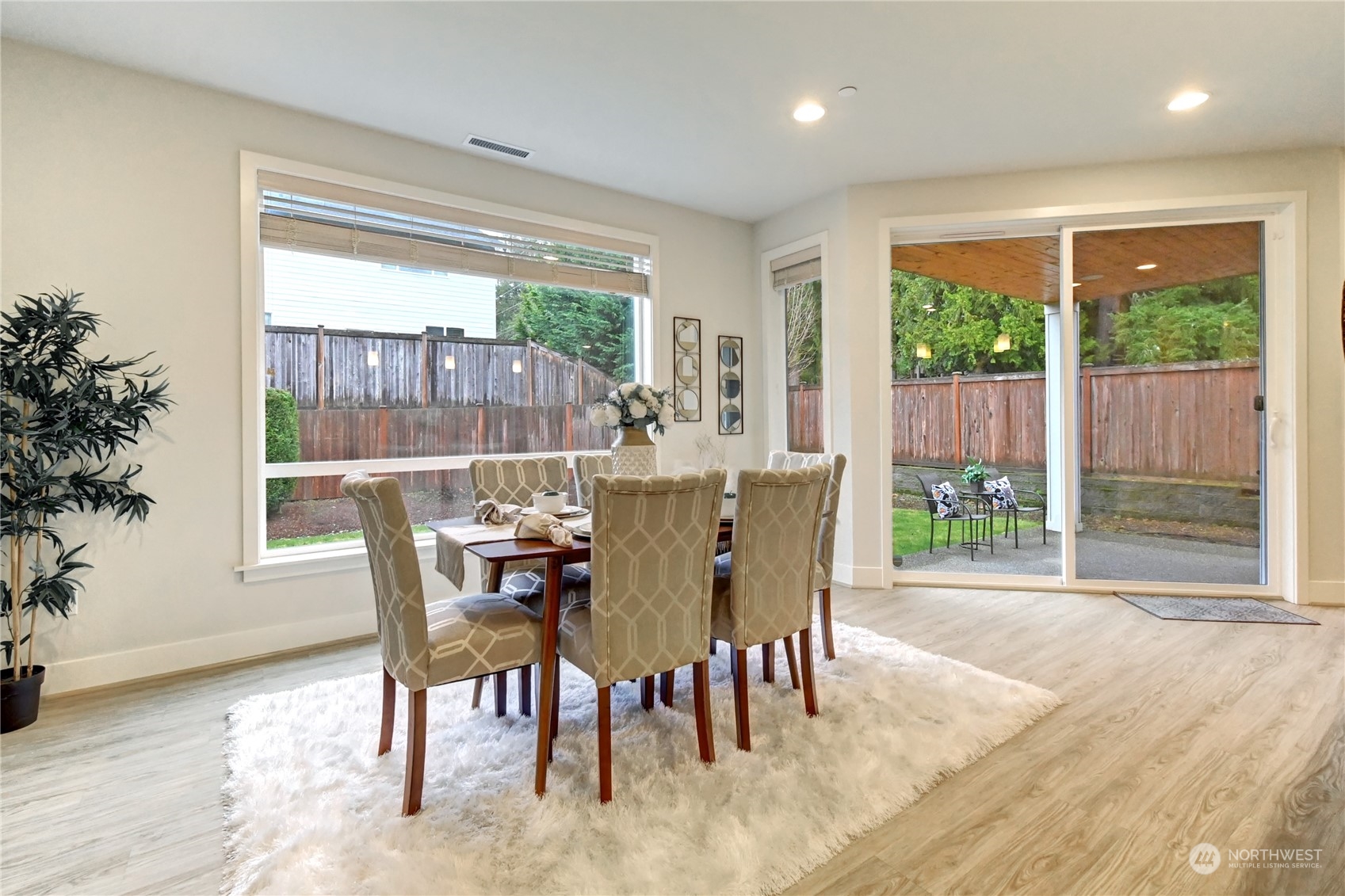 4431 231st Place Southeast Bothell, WA 98021 - Photo 10 of 36 a view of a dining room with furniture window and wooden floor