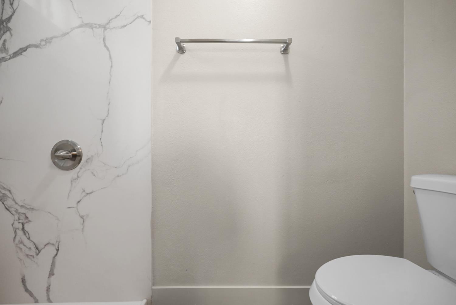 2832 Fowler Road Ceres, CA 95307 - Photo 9 of 28 a white toilet sitting next to a shower