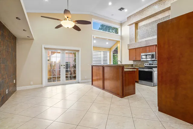a kitchen with stainless steel appliances granite countertop a stove and a refrigerator