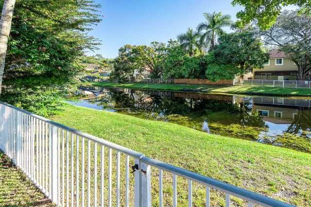 a view of a lake with a house in the background