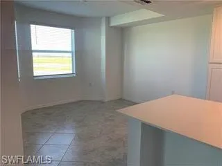 a view of a room with a large window