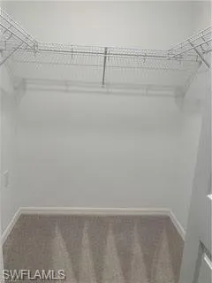 a bathroom with a shower sink and vanity