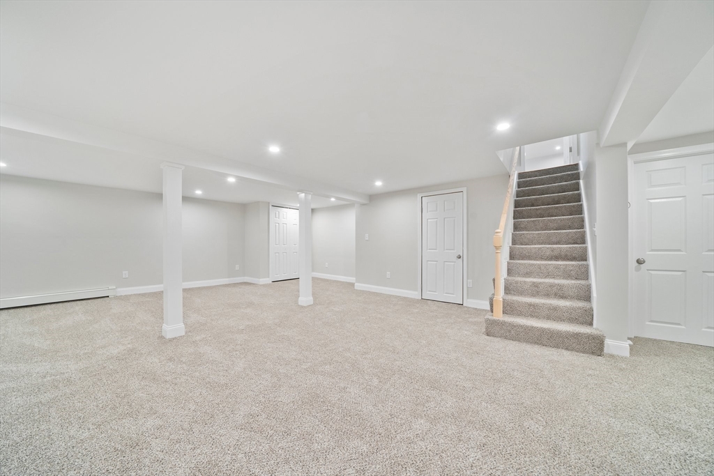 26 Leonard Road Sharon, MA 02067 - Photo 18 of 25 a view of an empty room with a kitchen