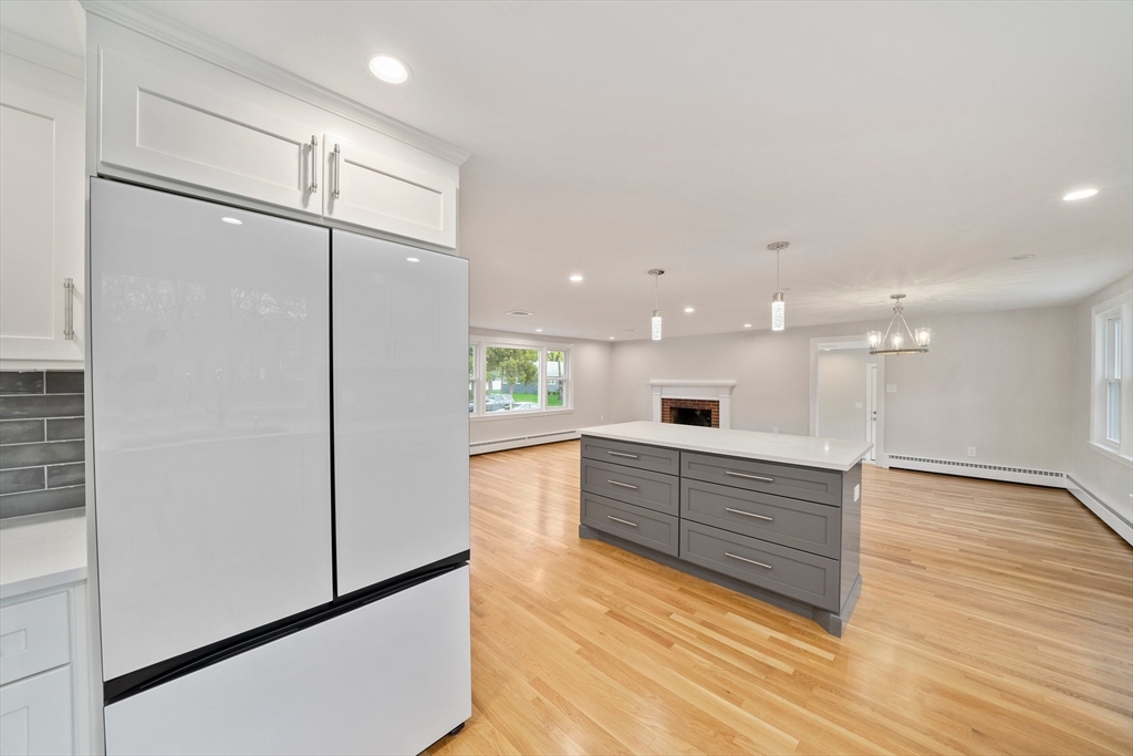 26 Leonard Road Sharon, MA 02067 - Photo 8 of 25 a large kitchen with kitchen island a sink stainless steel appliances and cabinets