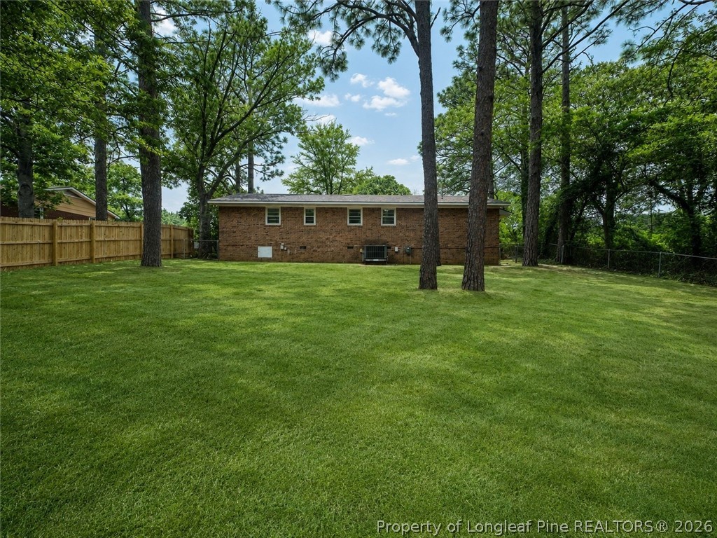 1404 Hibiscus Road Fayetteville, NC 28311 - Photo 3 of 10 a house with a tree in front of it