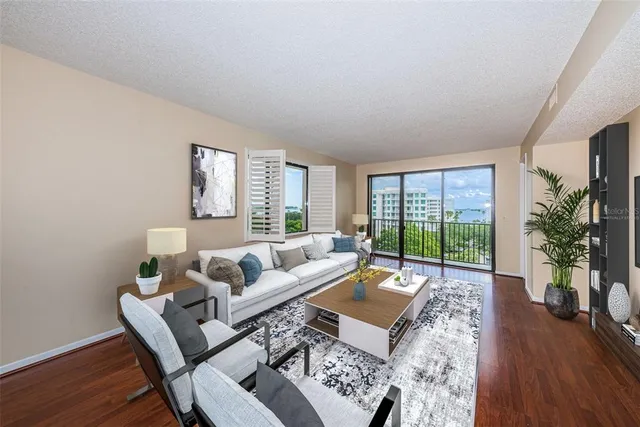 a view of a kitchen with a wooden floor and a kitchen