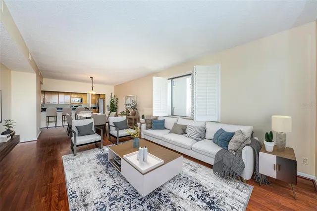 a kitchen with stainless steel appliances granite countertop a stove and a microwave
