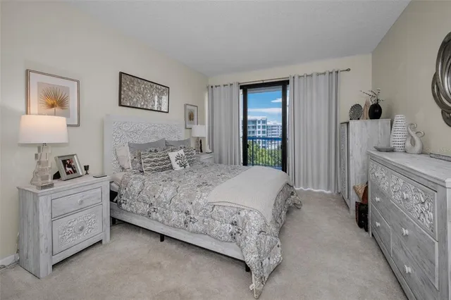 a kitchen with granite countertop stainless steel appliances and refrigerator