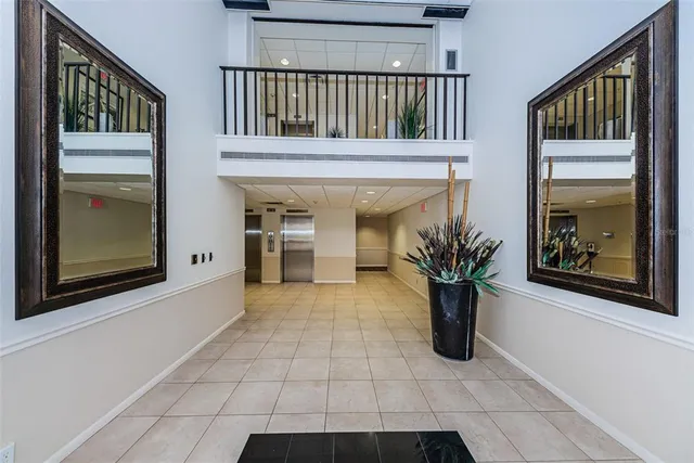 a view of staircase with a potted plant and a window