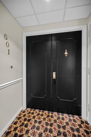 a view of a dining room with furniture wooden floor and a chandelier