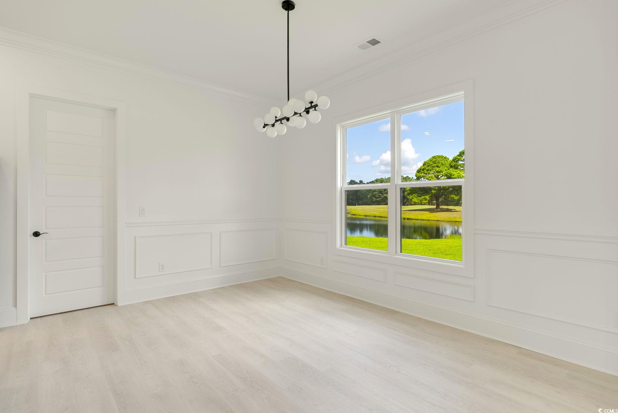 1109 Whooping Crane Drive Conway, SC 29526 - Photo 13 of 39 Unfurnished room with ornamental molding, a water