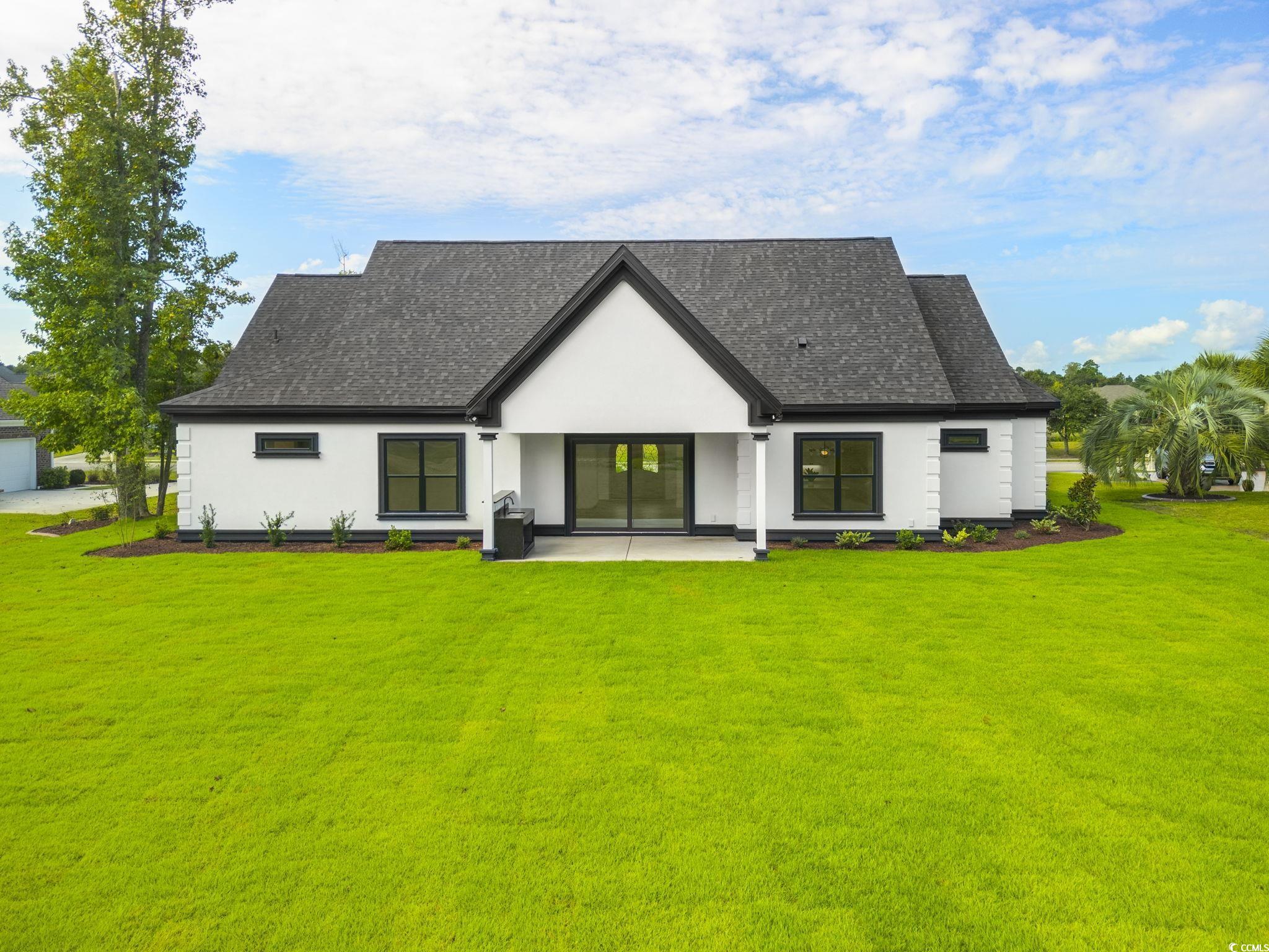 1109 Whooping Crane Drive Conway, SC 29526 - Photo 2 of 39 Back of property with a yard and a patio area