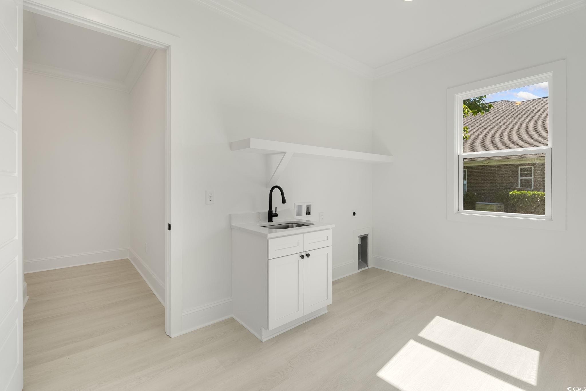 1109 Whooping Crane Drive Conway, SC 29526 - Photo 31 of 39 Washroom with washer hookup, light wood-type floor