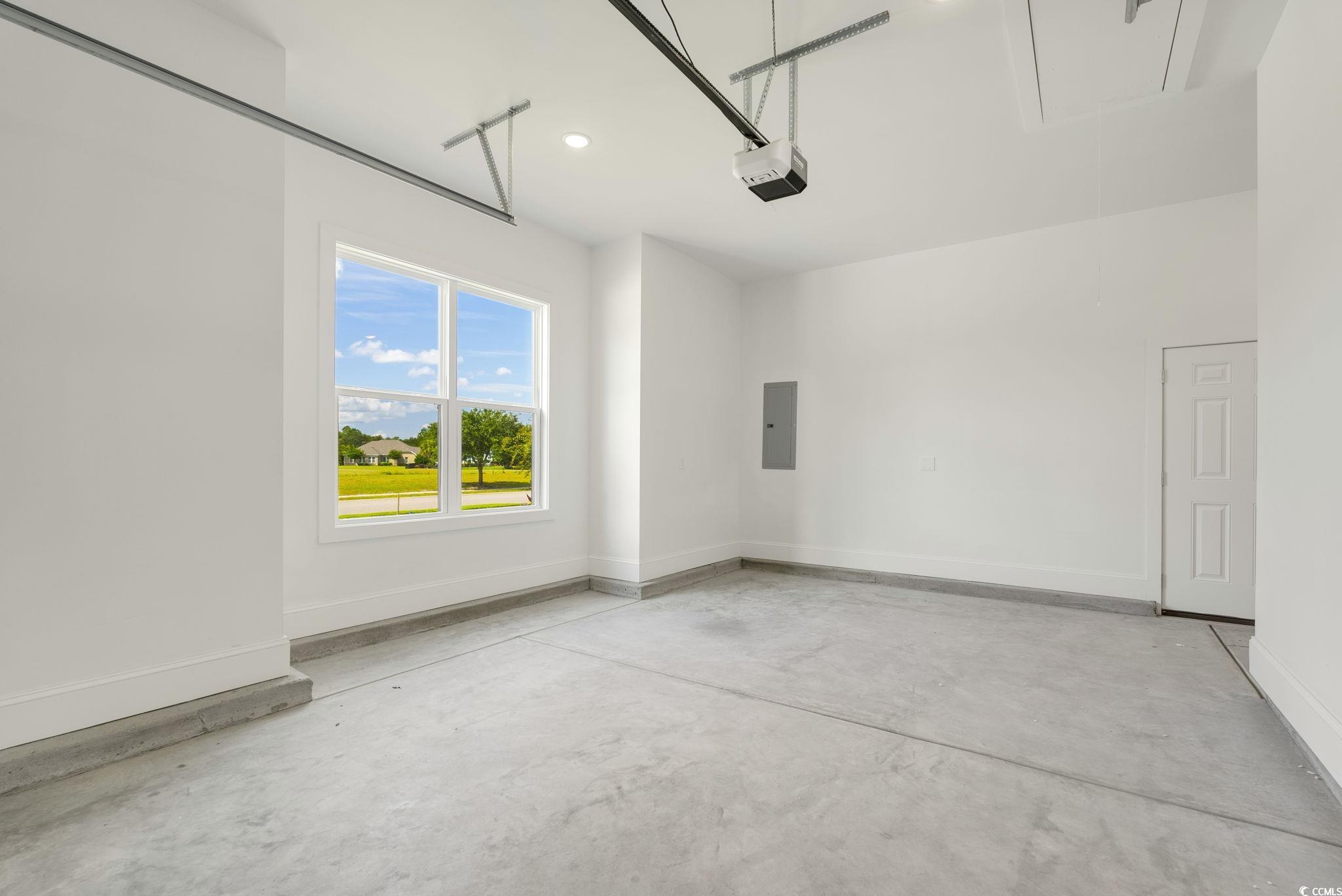 1109 Whooping Crane Drive Conway, SC 29526 - Photo 32 of 39 Garage featuring a garage door opener and electric