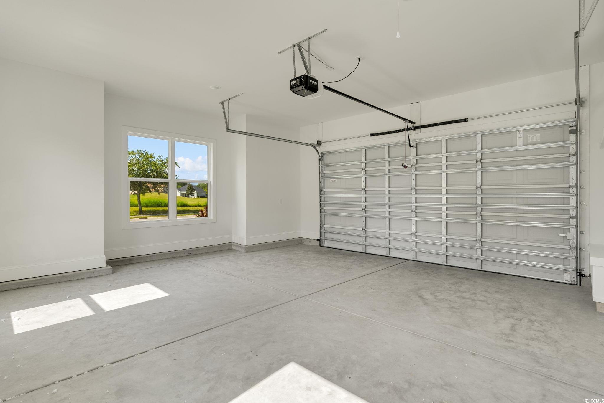 1109 Whooping Crane Drive Conway, SC 29526 - Photo 33 of 39 Garage with a garage door opener