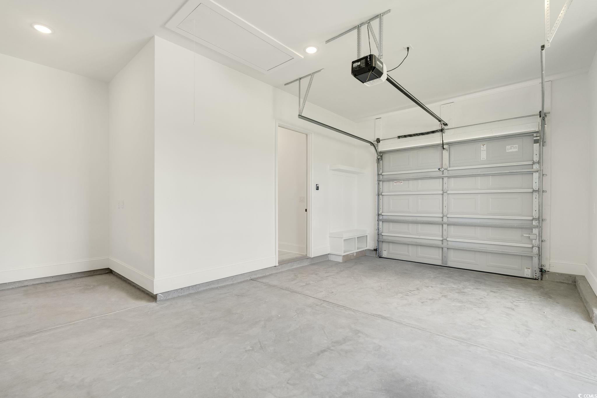 1109 Whooping Crane Drive Conway, SC 29526 - Photo 34 of 39 Garage with a garage door opener