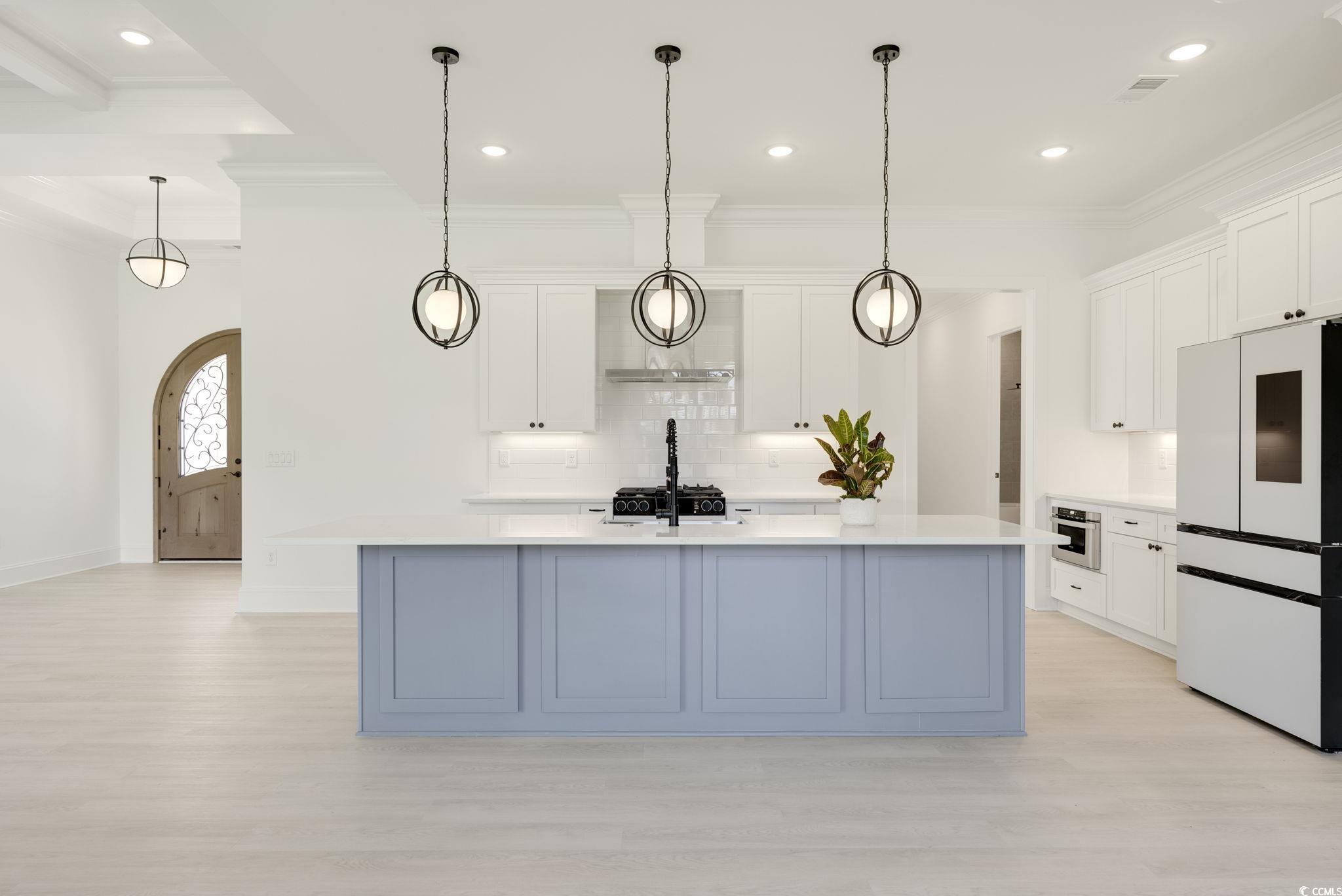 1109 Whooping Crane Drive Conway, SC 29526 - Photo 10 of 39 Kitchen with white refrigerator, a center island w
