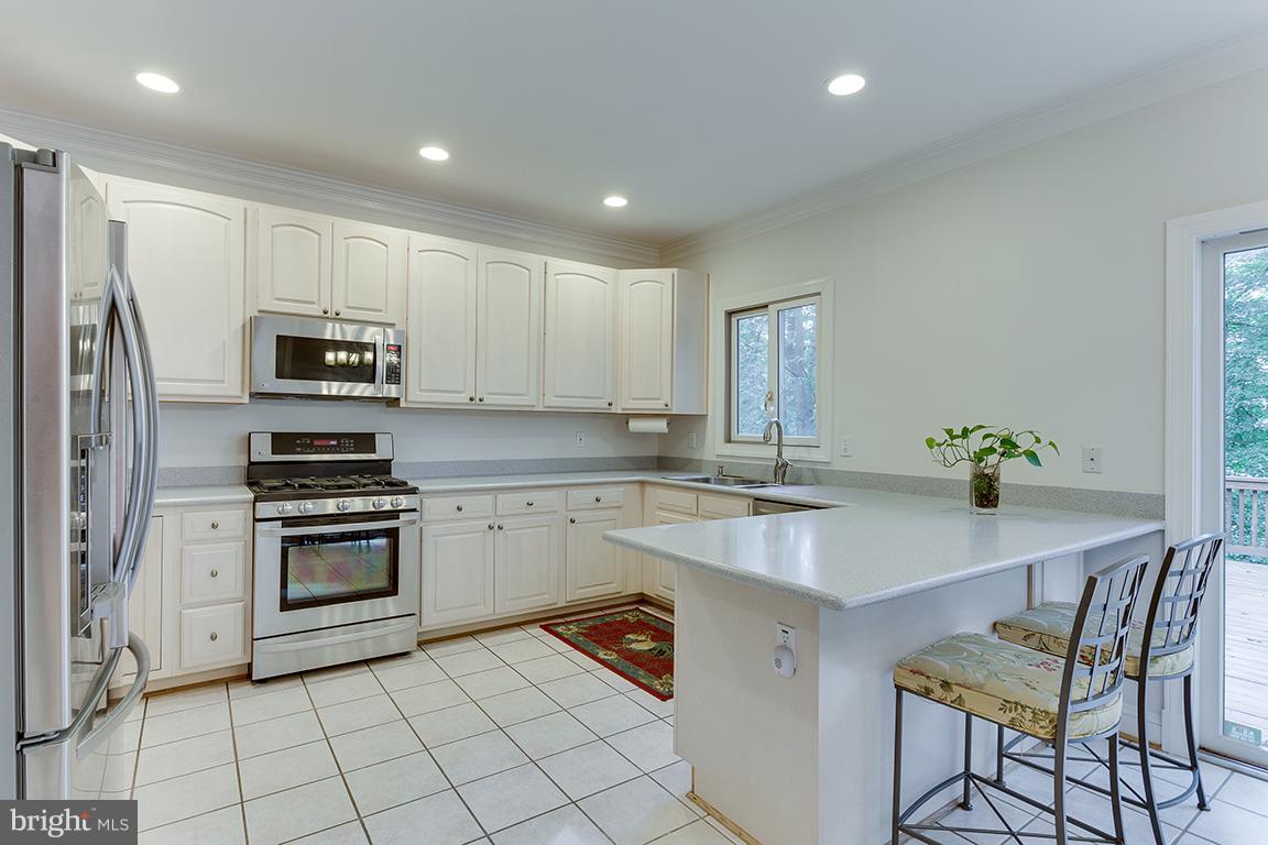 8002 Overhill Road Bethesda, MD 20814 - Photo 12 of 30 Stainless steel appliances and bar