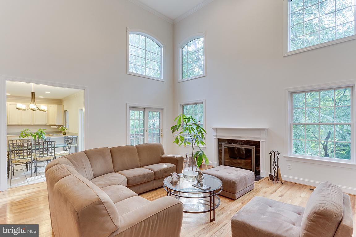 8002 Overhill Road Bethesda, MD 20814 - Photo 7 of 30 Family Room with Fireplace and two story ceilings