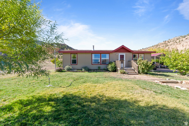3135 North Thompson Cyn Road Green River, UT 84525 - Photo 40 of 41 View of front of home featuring a front yard