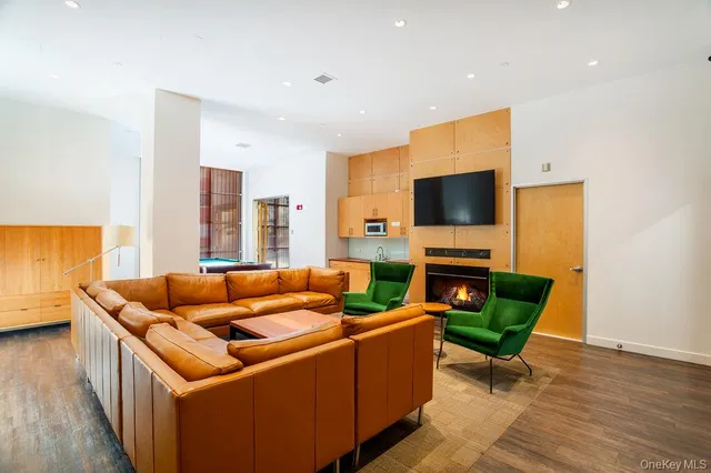 a room with pool table and windows