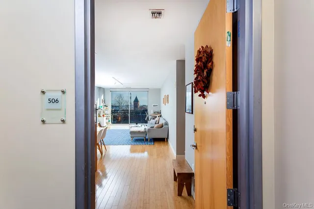 view of living room with furniture and a large window