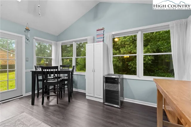 a view of a dining room with furniture and window