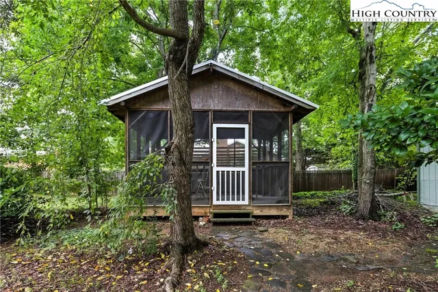 a backyard of a house with lots of green space