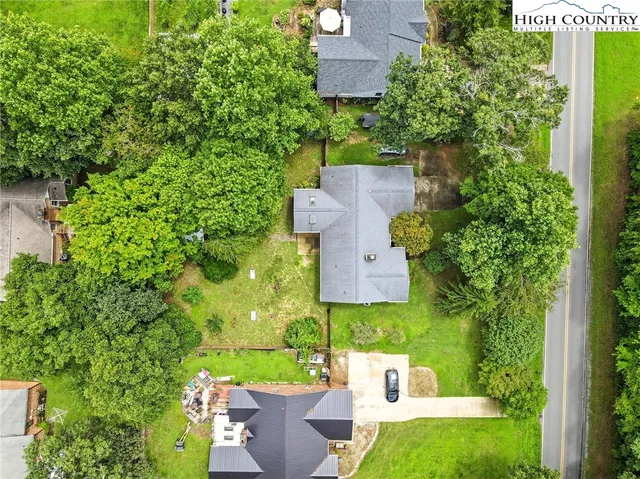an aerial view of a house with a garden