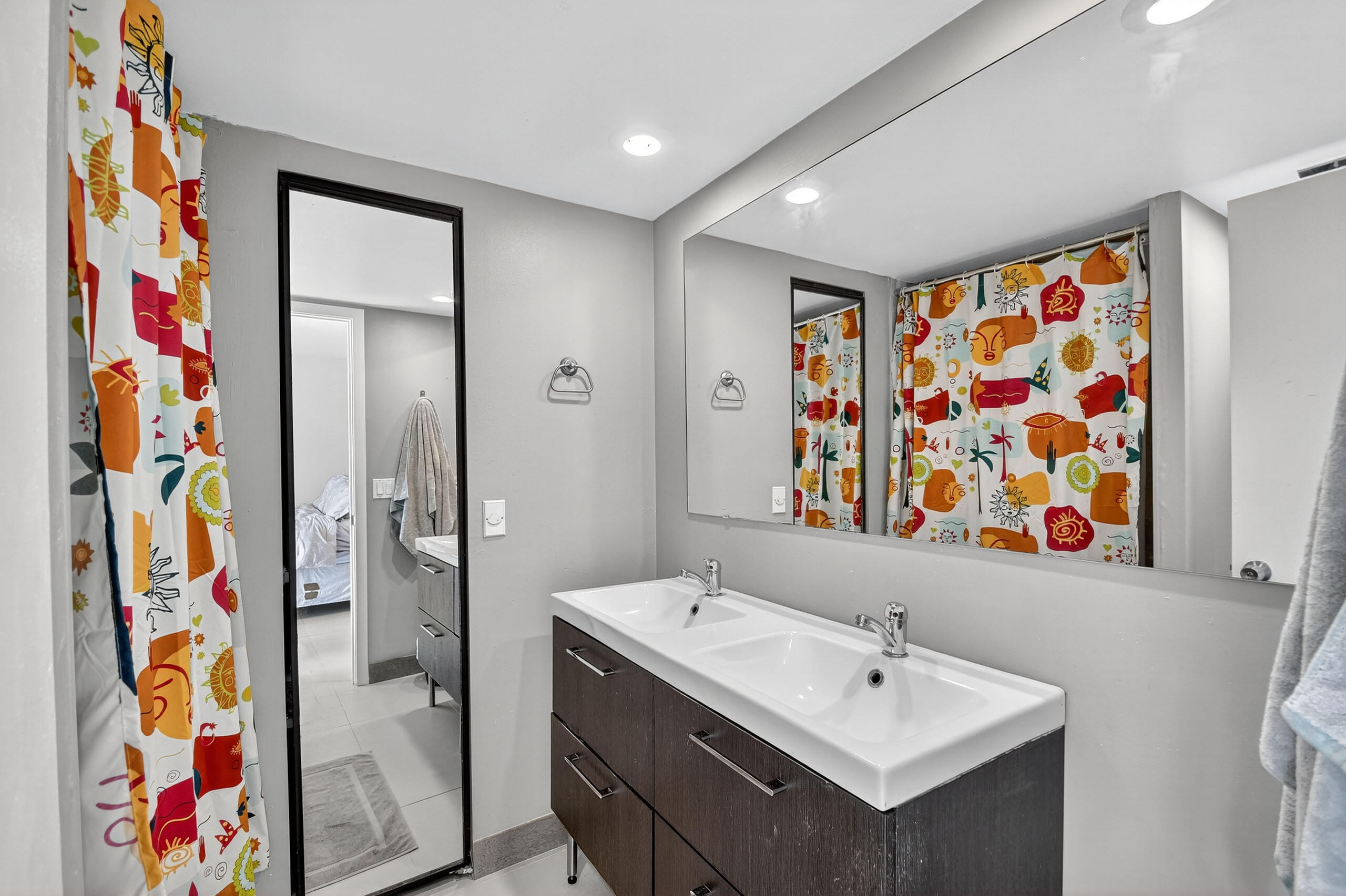 1540 Masters Circle, Unit 180 Delray Beach, FL 33445 - Photo 15 of 28 a bathroom with a sink and a mirror