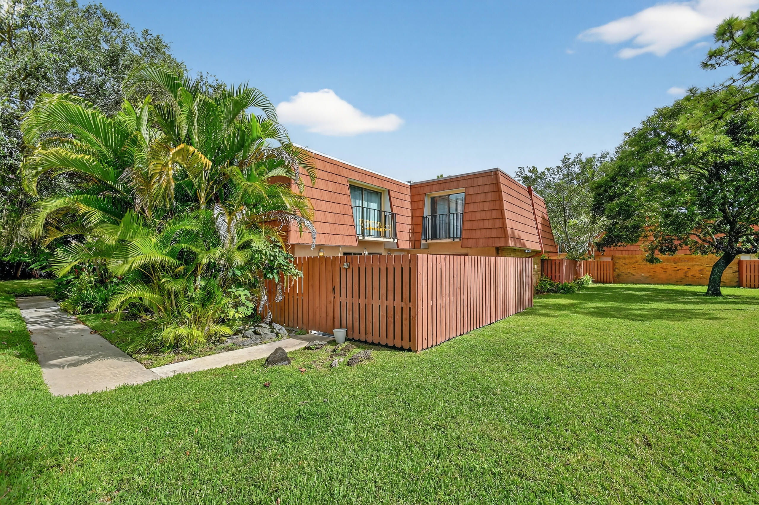 1540 Masters Circle, Unit 180 Delray Beach, FL 33445 - Photo 2 of 28 a view of a house with a backyard