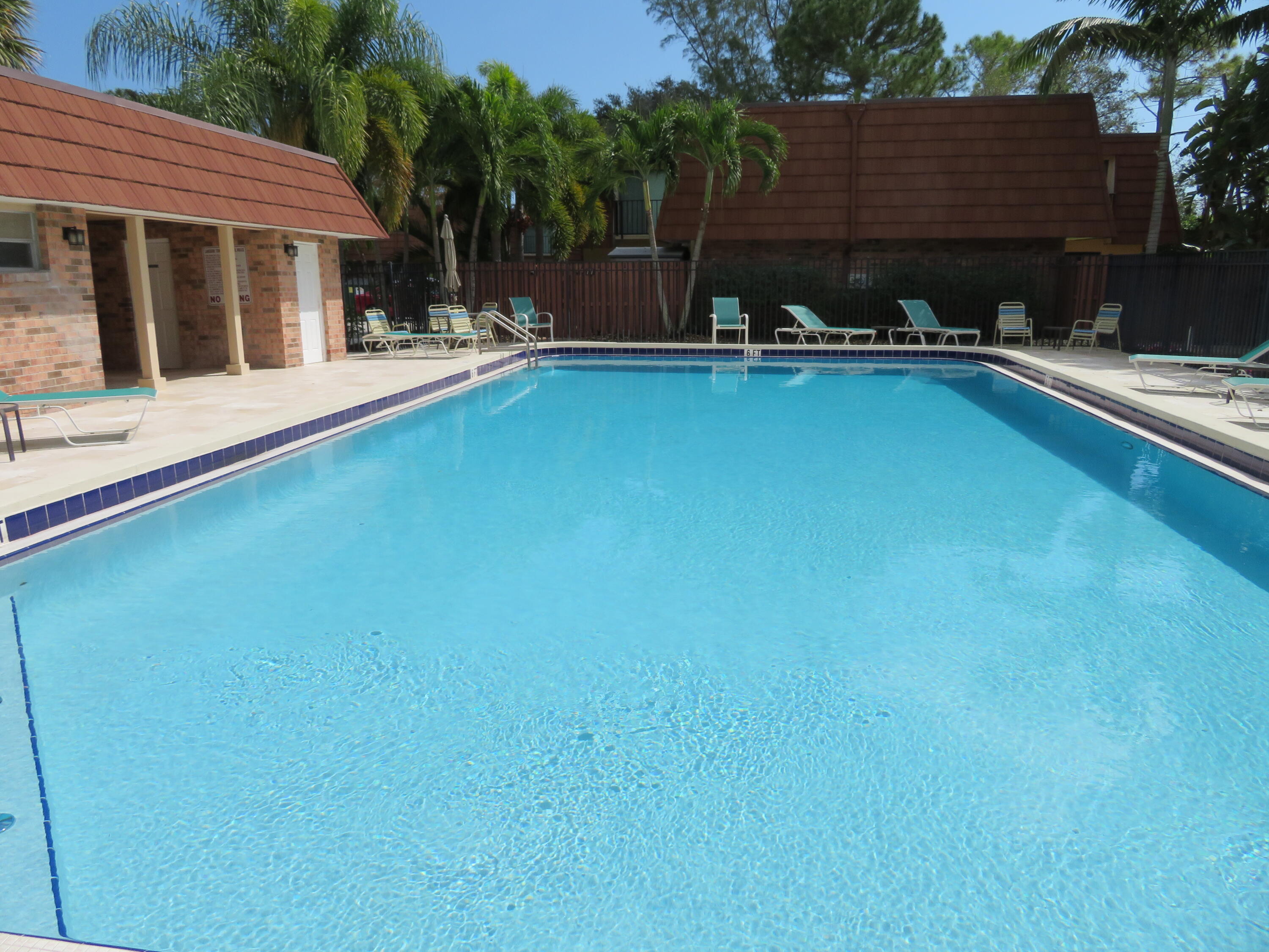 1540 Masters Circle, Unit 180 Delray Beach, FL 33445 - Photo 27 of 28 a view of a house with backyard porch and sitting area