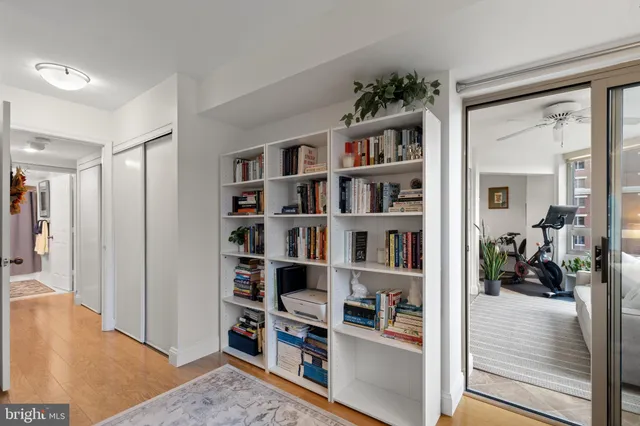 a bedroom with a bed and a flat screen television