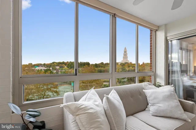 a living room with a large window next to a yard