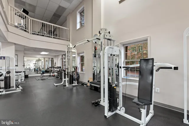 a man walking down a street next to a building