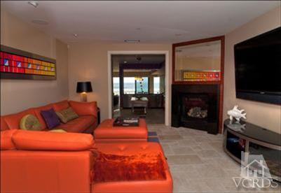 905 Mandalay Beach Road Oxnard, CA 93035 - Photo 19 of 30 a living room with furniture a flat screen tv and a fireplace