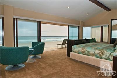 905 Mandalay Beach Road Oxnard, CA 93035 - Photo 22 of 30 a bed sitting in a room next to a large window